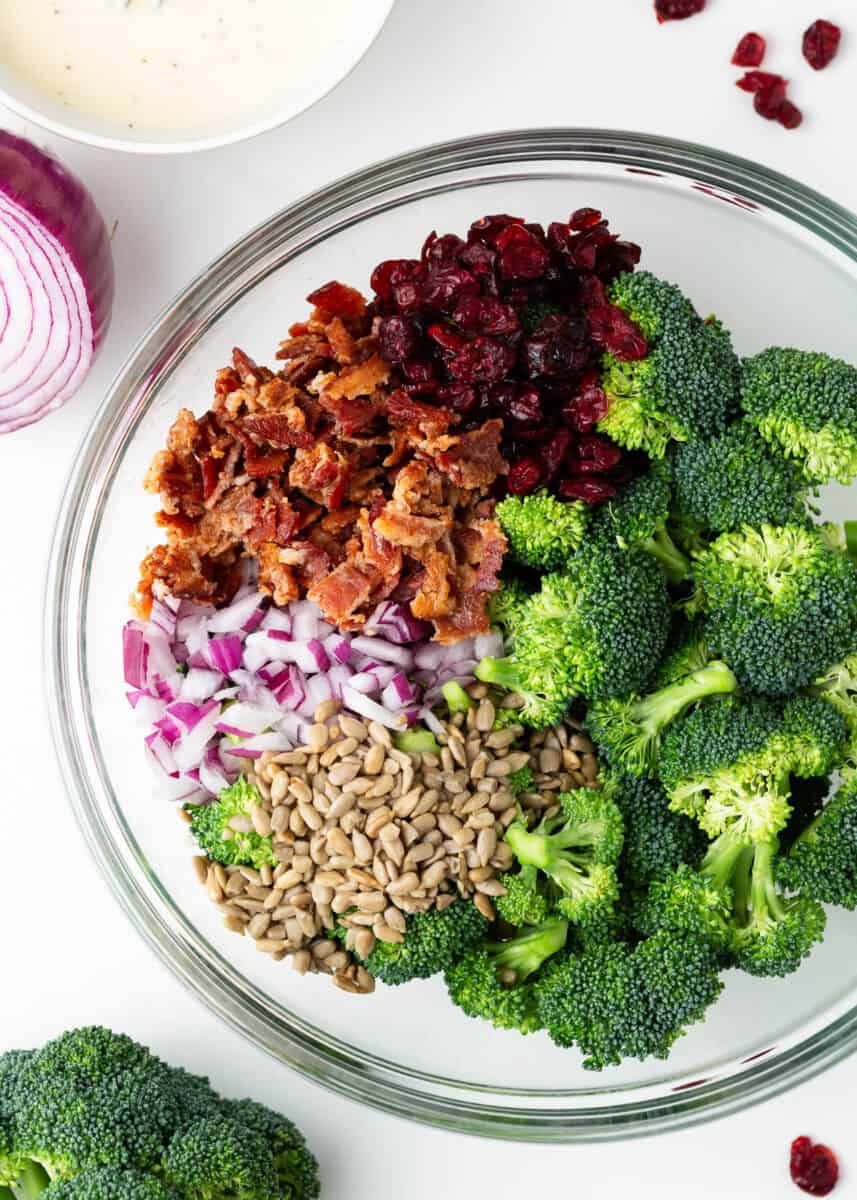 Broccoli bacon salad ingredients in a bowl.