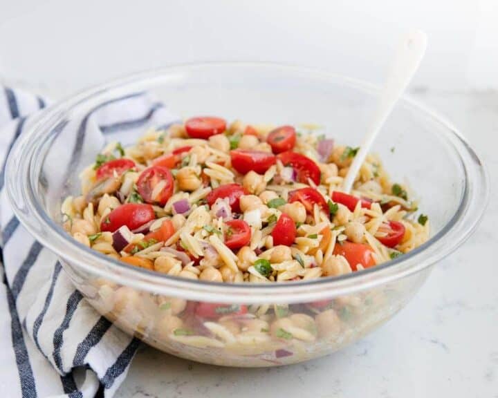 orzo pasta salad in a glass bowl 