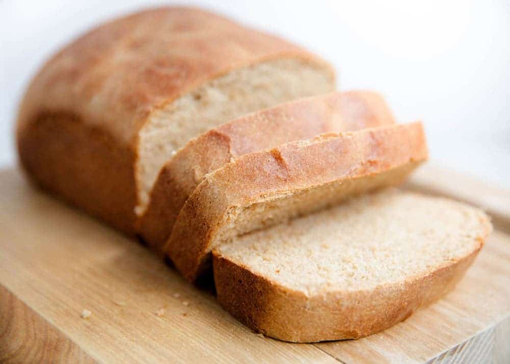 Loaf of whole wheat bread that's sliced.