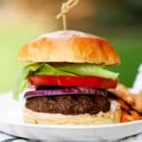 a close up of a hamburger on a plate