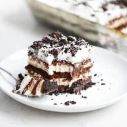 piece of oreo ice cream cake on a white plate