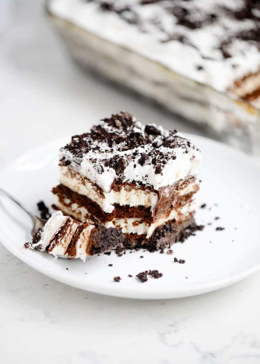 piece of Oreo cookie ice cream cake on a white plate 