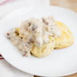 biscuits and gravy on a white plate