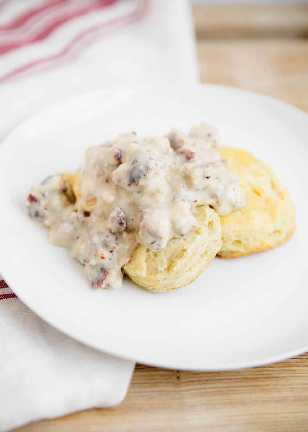 biscuits and gravy on a white plate 