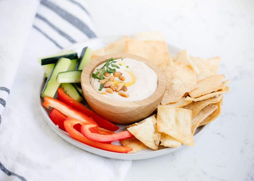 white bean hummus with fresh veggies and pita chips 