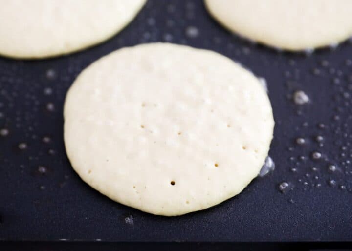ricotta pancakes cooking on griddle 