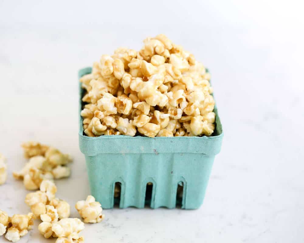 Caramel corn in a blue carton.