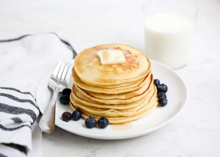 Easy Ricotta Pancakes - Super rich, moist and incredibly delicious. Pairs perfectly with maple syrup and fresh berries. My family absolutely LOVES this ricotta pancake recipe! Ricotta pancakes