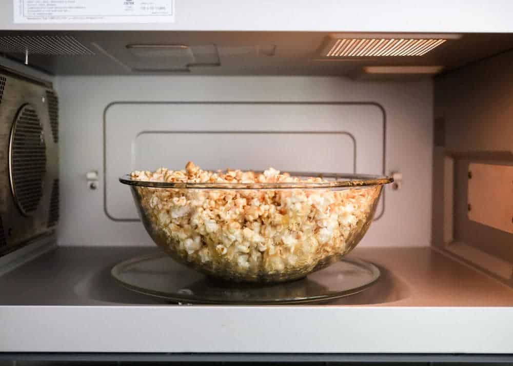 Bowl of caramel corn in the microwave.