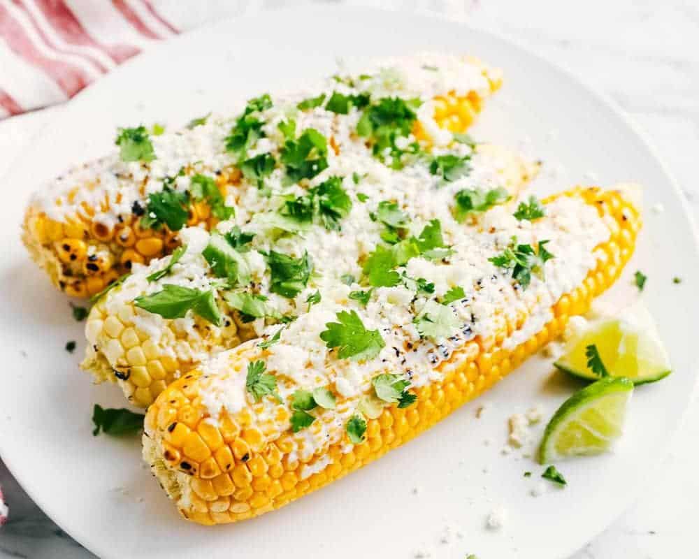 Mexican street corn on plate.