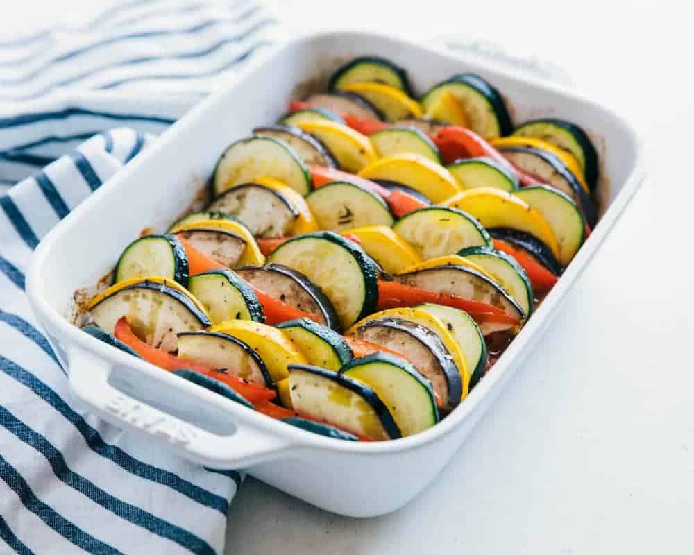 Ratatouille in a white baking dish.