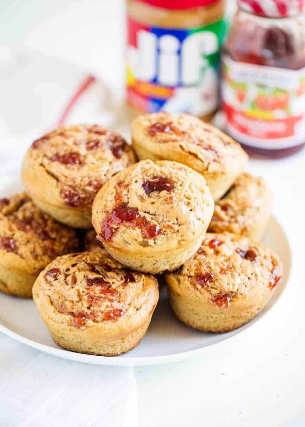 Plate full of peanut butter and jelly muffins.