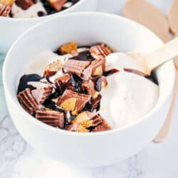 bowl of homemade ice cream with chopped Reese's and hot fudge