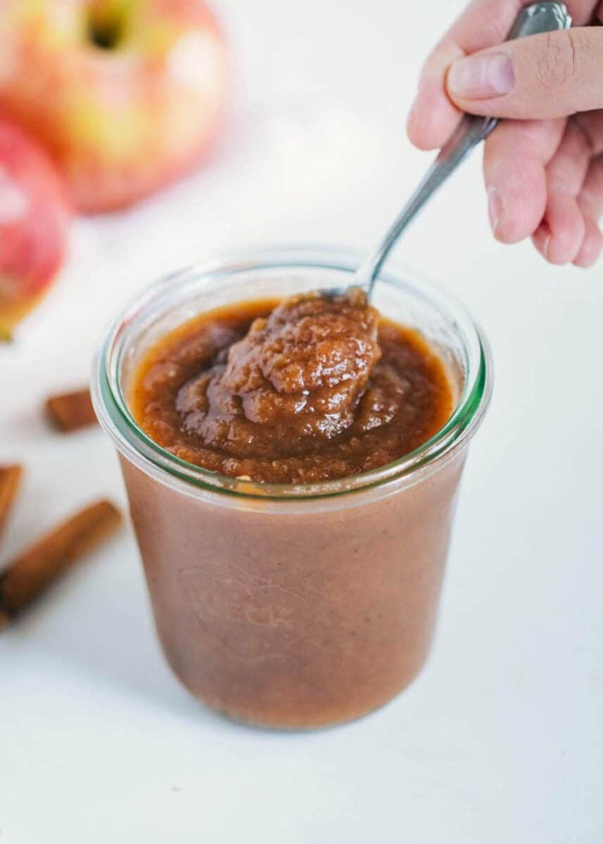 apple butter in jar with spoon 