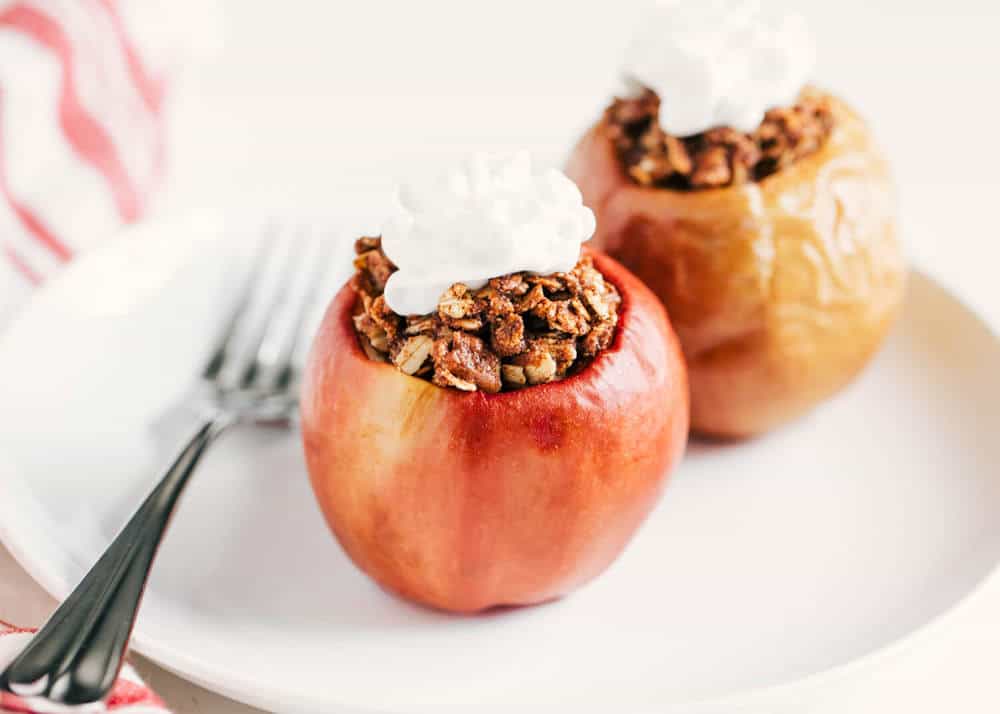 Cinnamon oat baked apple on plate.