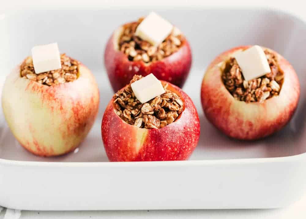 Stuffed apples in baking pan.