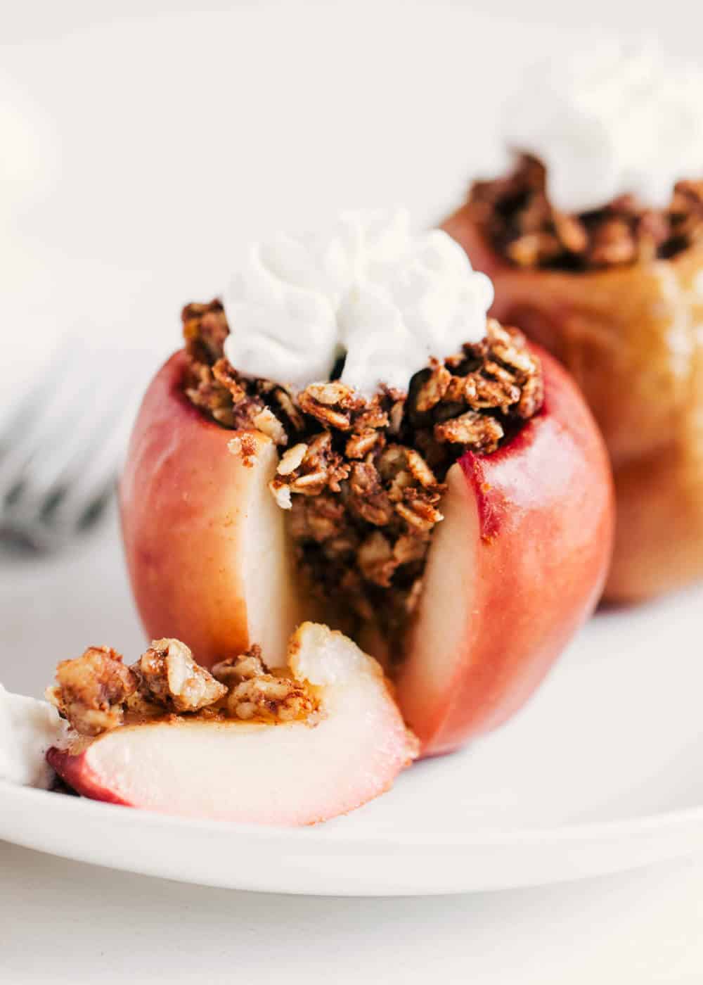 Cinnamon oat baked apple that's cut open.