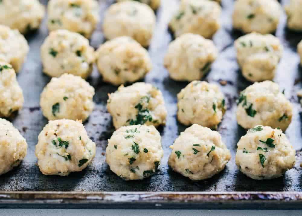 Healthy turkey meatballs on a baking sheet.