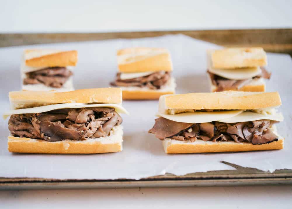 french dip sandwiches getting ready to go into the oven 