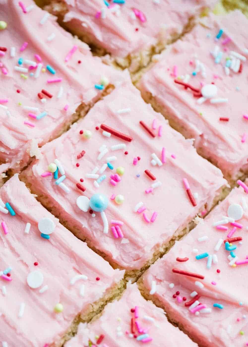Frosted sugar cookie bars with sprinkles.