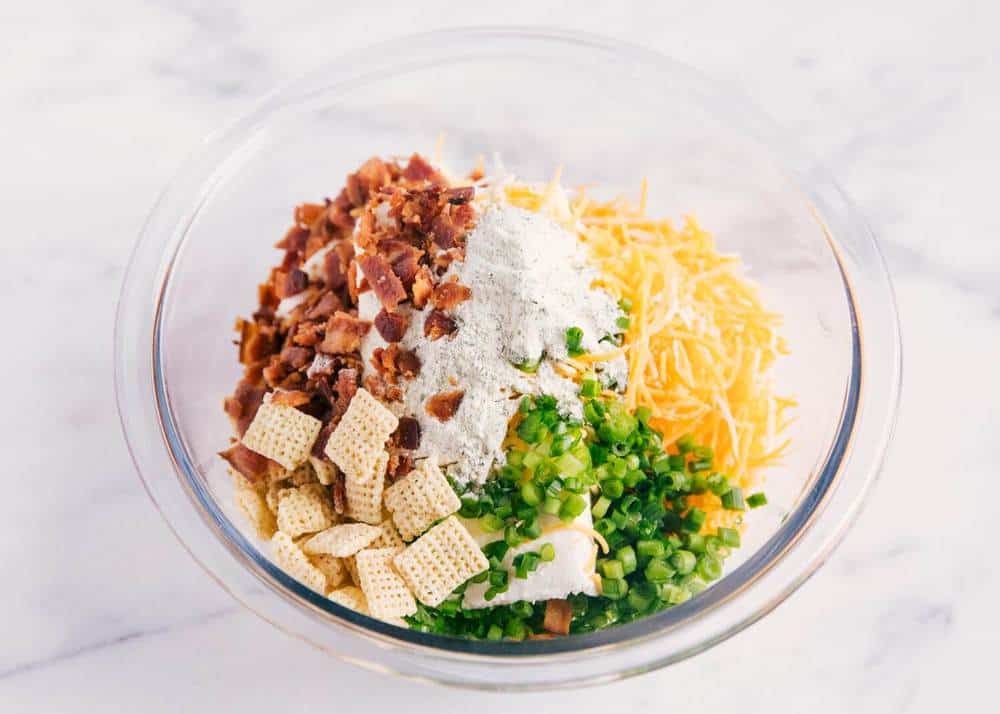 Ingredients for bacon ranch cheese ball in a glass bowl.