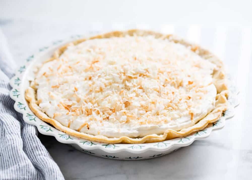 Coconut cream pie in pie pan.