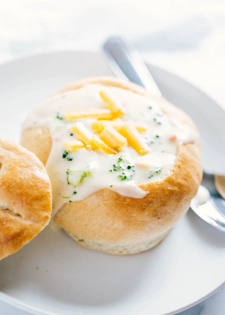 bread bowl with broccoli cheese soup inside 