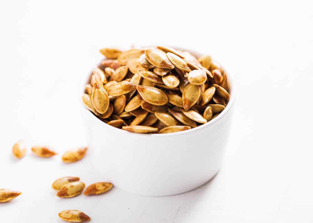 Bowl of roasted pumpkin seeds.