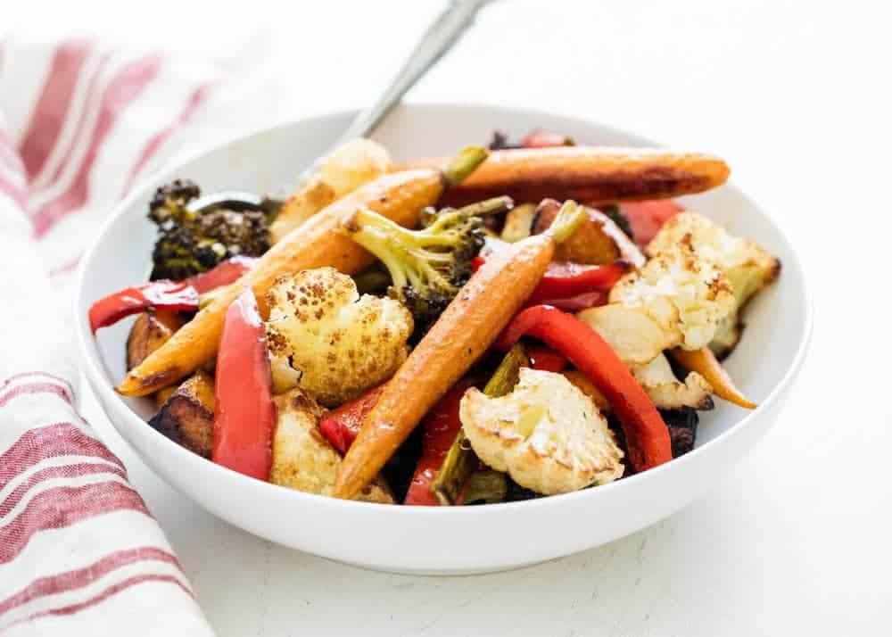Roasted vegetables in a white bowl.