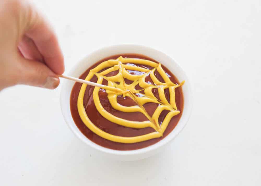 Spider web ketchup and mustard sauce.