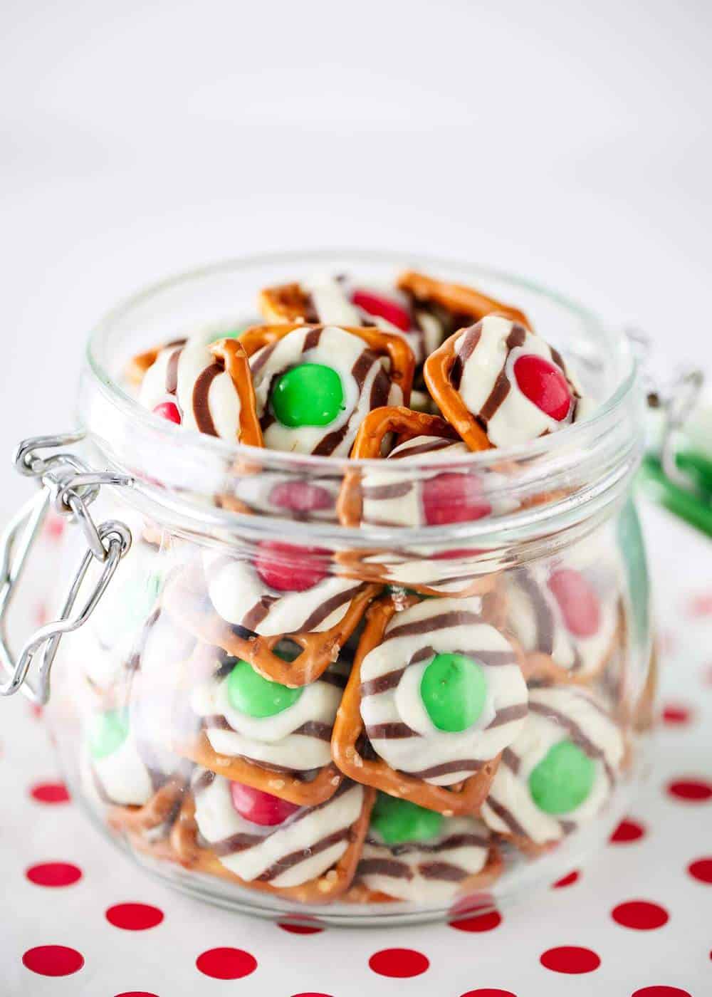 Christmas pretzel hugs in a glass container.