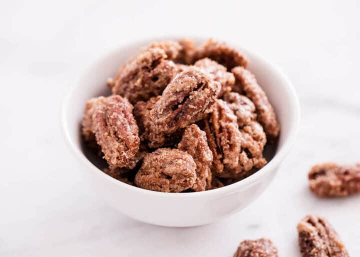 candied pecans in white bowl