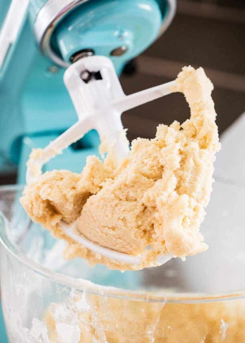 mixing butter cookie dough in mixer 