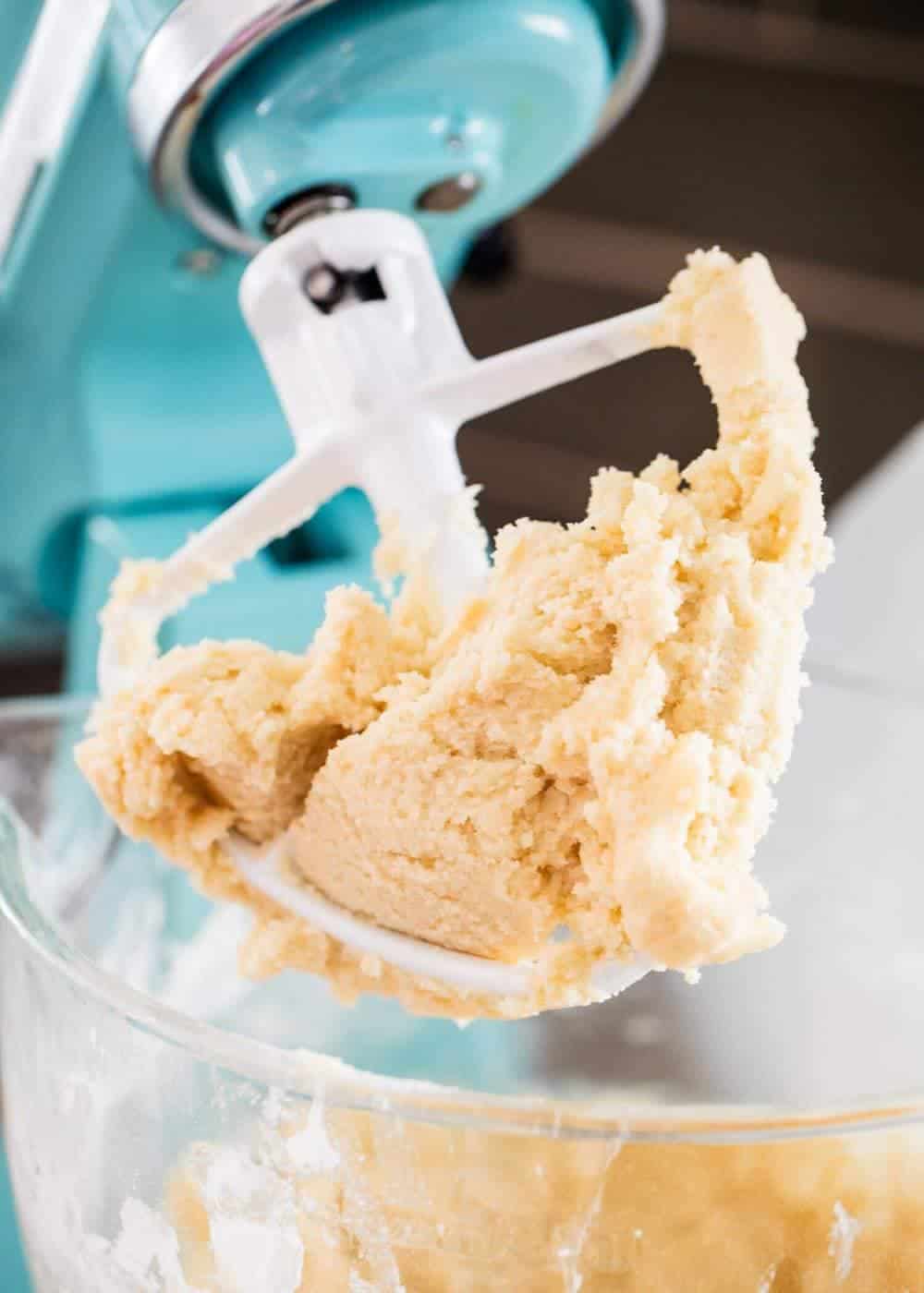 Mixing butter cookie dough in mixer.