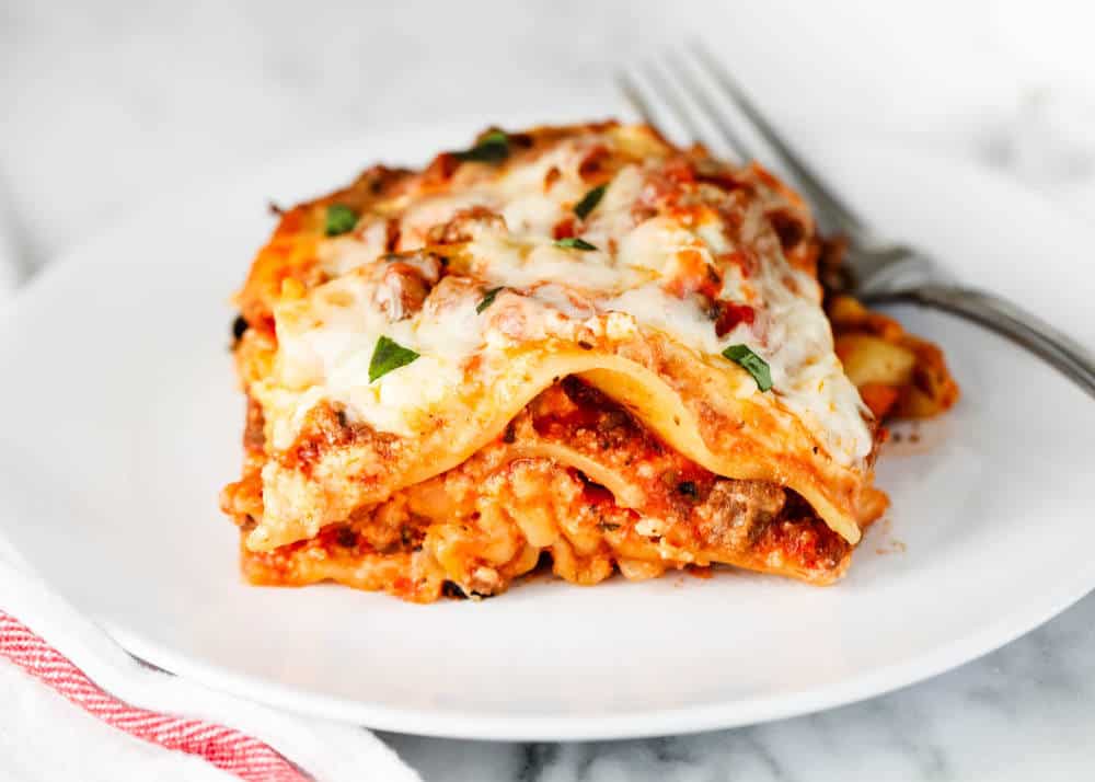 Lasagna on a white plate. 