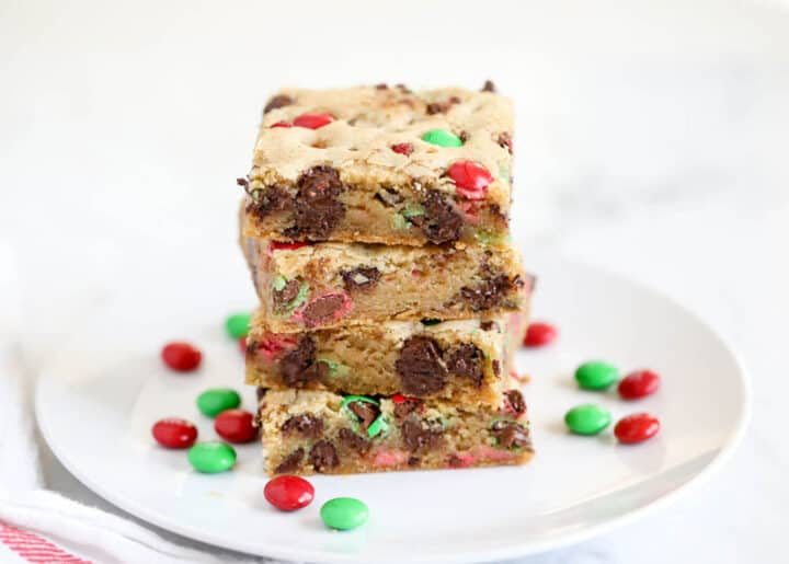 m&m cookie bars stacked on plate 