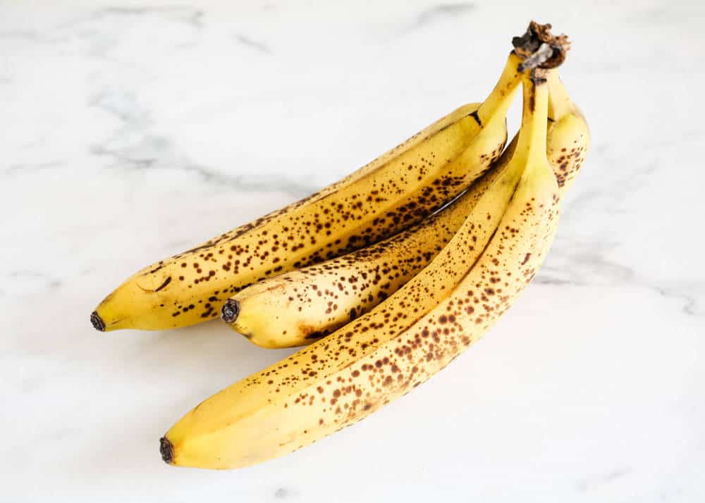 Ripe bananas with brown spots.
