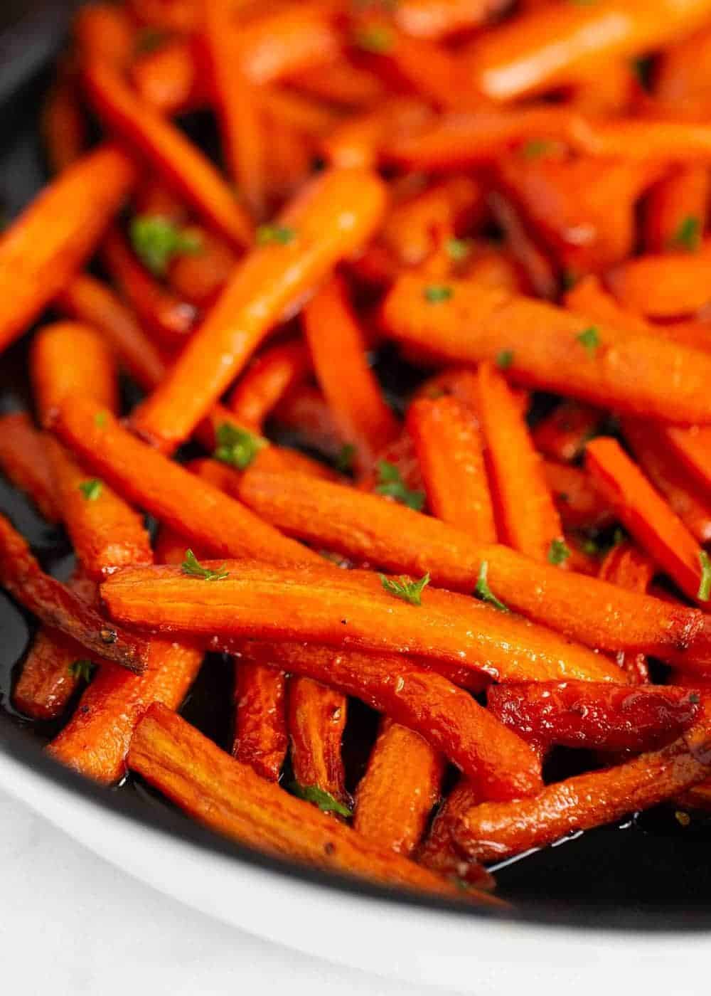 Brown sugar carrots in pan.