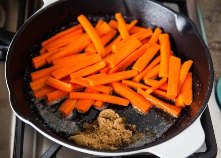 making candied carrots on skillet 