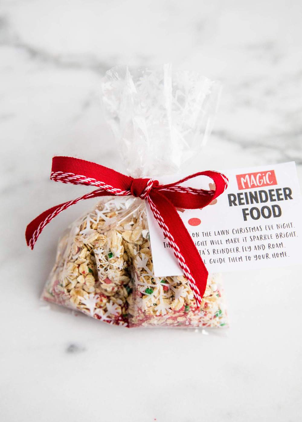 Bag of reindeer food with red bow and poem tag. 