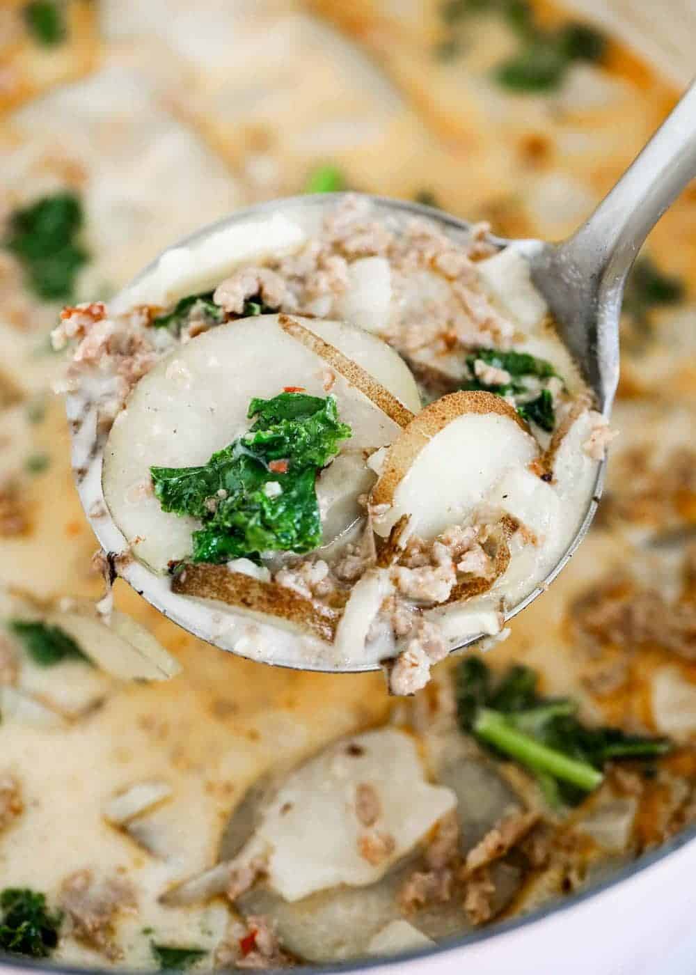 Ladle of zuppa toscana soup.