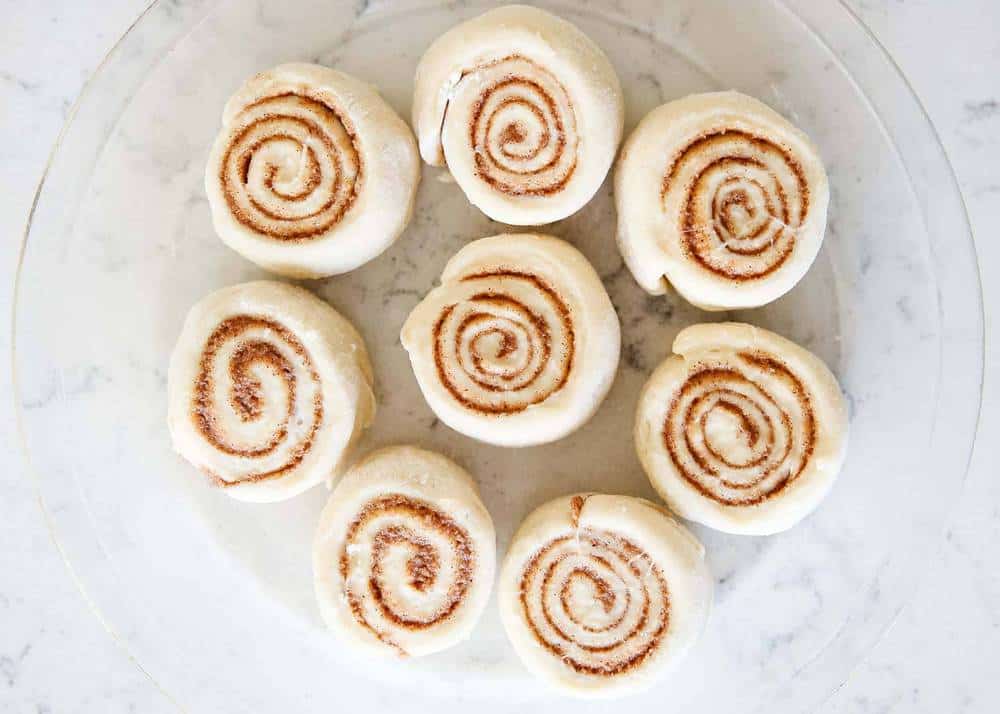 Cinnamon rolls in a glass dish.