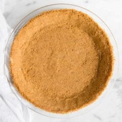 Graham cracker crust pressed into a pie pan.