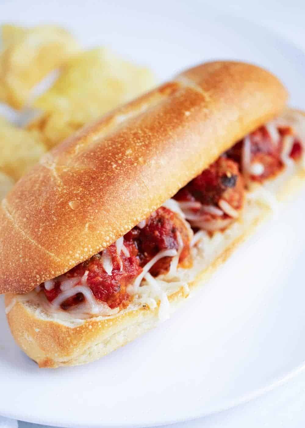 Meatball sandwich on plate.