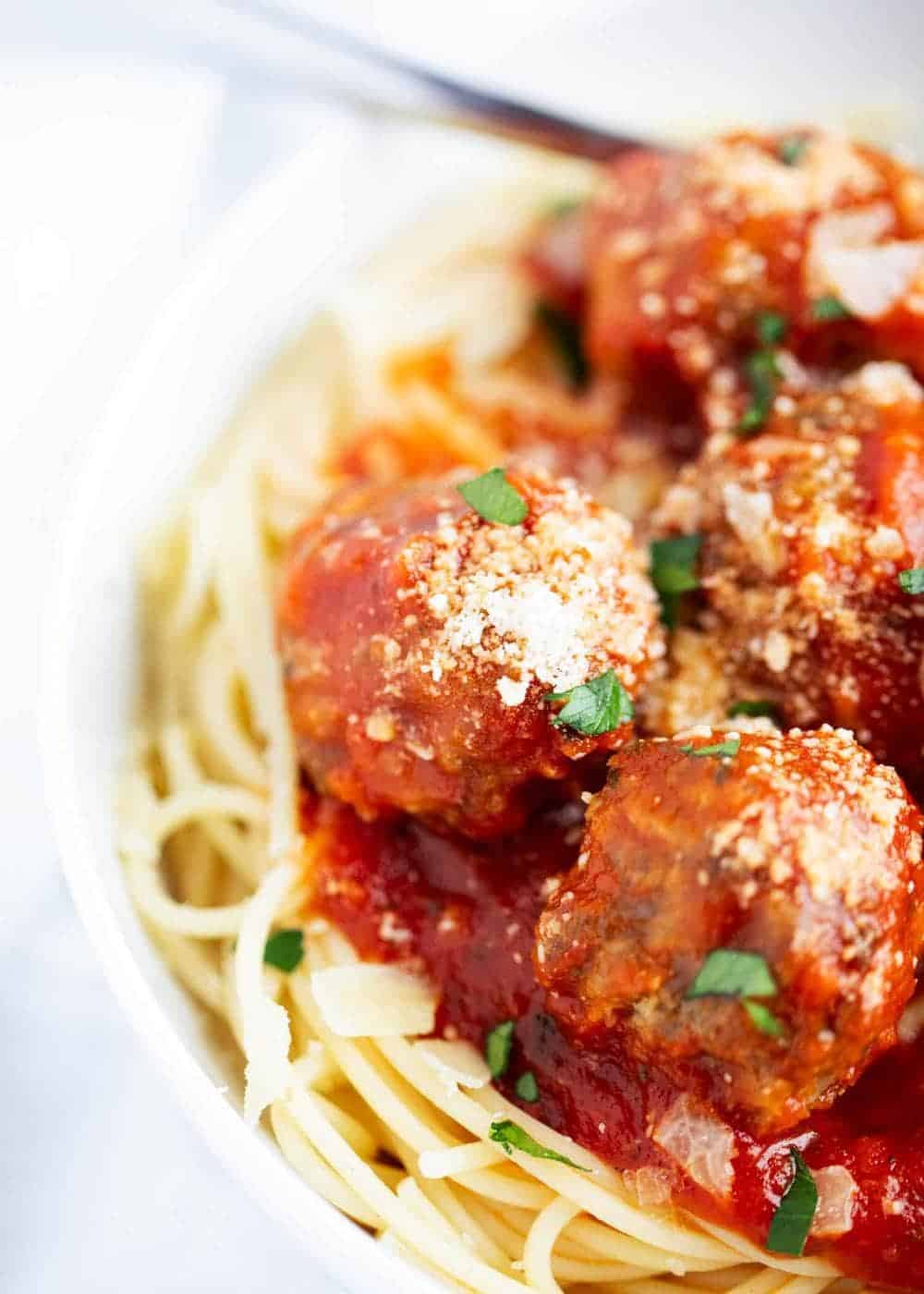 Spaghetti and meatballs with marinara and parmesan cheese 