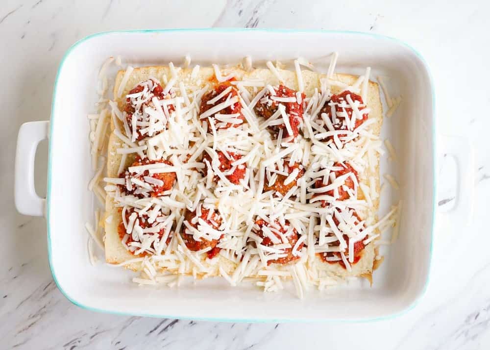 Meatball sliders in a the casserole dish. 