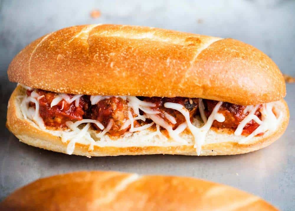 Meatball sub on baking sheet.