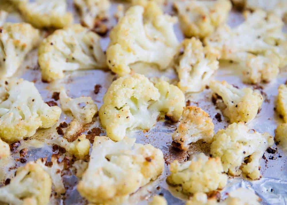 Parmesan roasted cauliflower on a baking sheet.