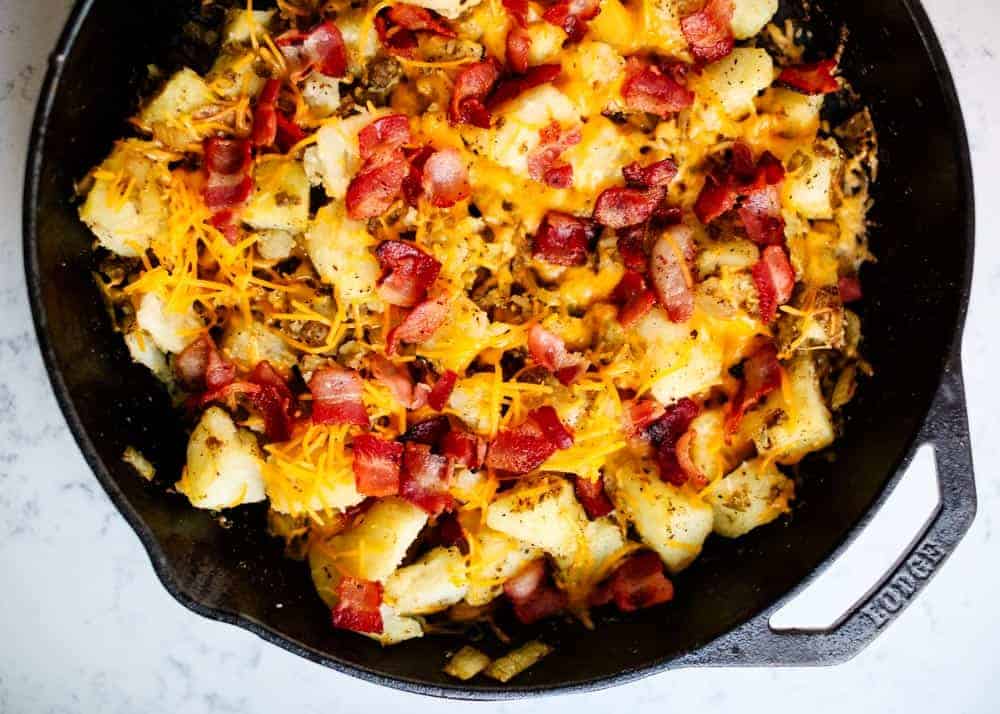 Breakfast potatoes in cast iron skillet.