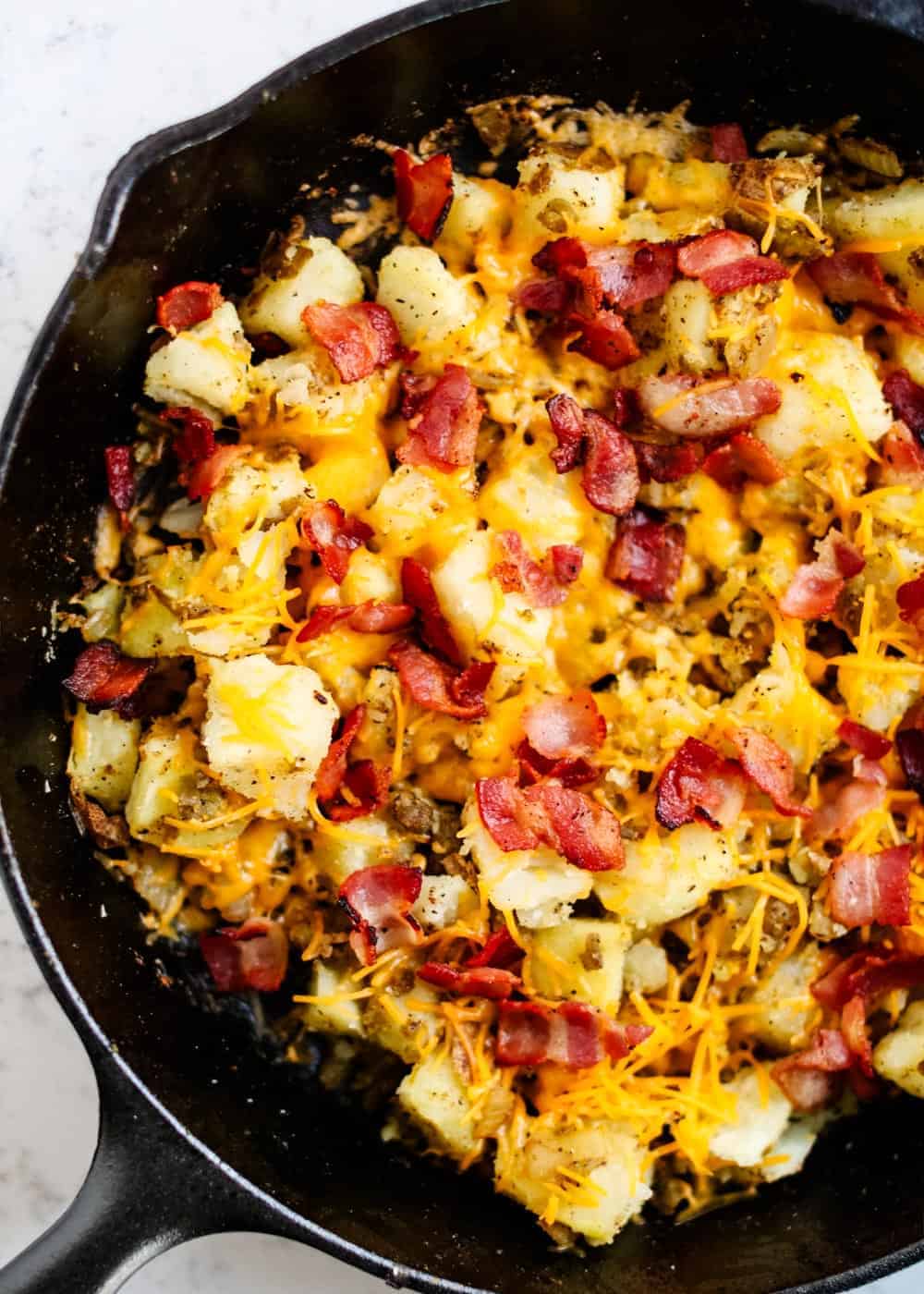 Breakfast potatoes in skillet.